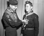 Frank Dingwerth pinning Eagle Scouts badge award on Julius Brunner Jr.