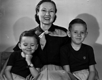 Mrs. A. N. Burk Shown with sons, Alan and John