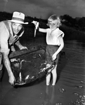 Jimmie Coran and Camilla Ritchey Saving Channel Catfish from Brouth