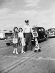 Springdale School: Shot of Motor Officer Milton Ellis and Janie Martin, and Sheila Ann Williams Using New Type School Zone Sign
