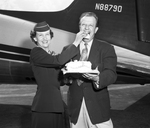 Central Airlines' Stewardess Rosemary Prigmore Feeds Third Birthday Cake to Central President Keith Kahle