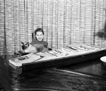 Miss Elise Criss Waggoner, debutante and her Siamese cat