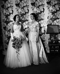 Debutante Alice Johnson Thomas of New Orleans Louisiana (left) with Mrs. E.J. McCurdy, president of the 37th Assembly Ball held at the River Crest Country Club