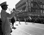Armistice Day Parade. Kenneth Vaughn plays taps in front of reviewing stand