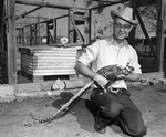 L. E. Birdman holding a pheasant