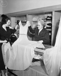 Mrs. Ralph Kimbrough and Mrs. Golda Mills admire merchandise