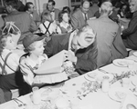 Mildred Ann Brasher and her dad attend a dinner.