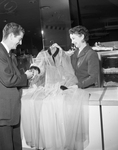 Johnny WalkerÂ and Mrs. Gladys F. Willis admire negligee