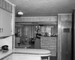 Mrs. I. M. Cochran in the combination room of her new home