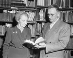 Mrs. Rose Lisenby, and Texas Wesleyan College Vice President Walter Glick in the library