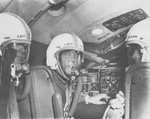 Three flight engineers wearing protective flight suits in a XC-99, Carswell Air Force Base