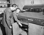 Mr. and Mrs. L. H. Weth demonstrate an electric stove