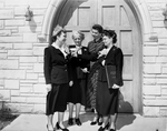Four woman outside a church