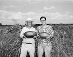 T. J. Tinney of Alvord and Herb Adcock of Alvord with watermelon