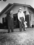 Jack McCullough and Russell S. Bowen spraying insecticide