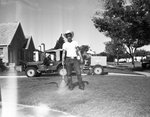 Tom Saunders, with sprayer used for lawn worms