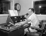 Tom Seay shown at KXOL's dual control board