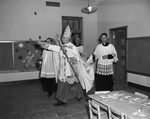 Most Reverend Thomas K. Gorman, and Reverends Thomas Collins, Bede Mitchel, and Monsignor Joseph Erbrick, in classroom at OLV, Catholics, Fort Worth