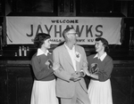 Schools, Kansas University, General. State Senator J. O. Gunnels of Colby with cheerleaders Mary Gayle Loveless and Sandra Puliver