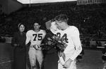 TCU Co-Captain crowning the homecoming queen at Amon Carter Stadium