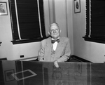 F. J. Adams in formal suit with bow tie