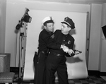 Police Sgt. T. J. Smith and Traffic Patrolman Orville J. Baker