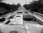 Reconstruction of a section of the old bridge spanning a dry creek bed on Park Hill Drive near Forest Park Boulevard, Fort Worth, Texas