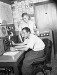 Antonio Saldarriaga shown operating amateur radio with E. D. Kuykendall Jr.
