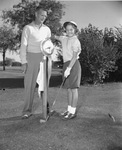 Sandra Jane Haynie, 11, youngest entrant in Women's Texas Open Golf Tournament, with father Jim