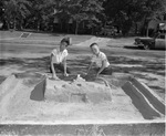 Freddy Drysdale and Sparky Jones build sandcastle Alamo
