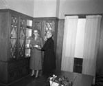 Mrs. C.O. Edwards (right) and sister Mrs. M.C. Chapman store china at the C.O. Edwards' home, originally built on Summit Avenue, now located at 39 Valley Ridge Road