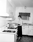 Mrs. Robert S. Suggs in the kitchen of the family residence on Eldridge Street, Fort Worth, Texas