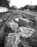 Big rocks unearthed during a street widening project on Forest Park Boulevard, Fort Worth, Texas