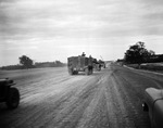 Truck units of 49th Armored Division driving on the new Dallas-Fort Worth toll road
