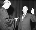 U.S. District Court Clerk John A. Lowther taking oath from Judge Estes