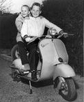 Edward and Bob Bass, sons of Perry Bass on Italian motor scooter that will be auctioned for charity, 01/16/1957