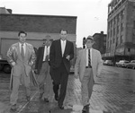 David Fred Hagler, right, walking to police station with Detective Paul Jones for questioning
