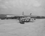 Experimental XB-36 bomber being towed past new B-58 bomber