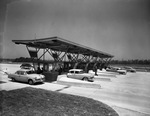 Cars making practice runs at Dallas-Fort Worth Turnpike toll gates before opening of the toll road