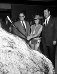 Miss Dallas-Fort Worth Turnpike June Prichard, cutting a giant pie