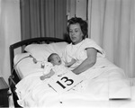 Mrs. Stanley Brezina in hospital with her 13th baby