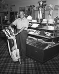 Alwyn McCombs with golf clubs