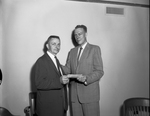 William J. Jerome, Wichita Falls, left, receives check from Henry A. Huettner, Dallas for Wahe-Hour Division effeciency suggestion