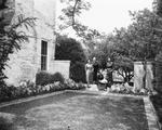 In the gateway of the Jack E. Greenman garden, are, Mrs. Harry H. Holtzer, seated, Mmes. Greenman, C. R. Craig and F. F. Hardesty