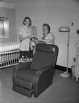 Mrs. Norman D. Chenault, left, with Mrs. Jane Siniard with chair and check donated to Fort Worth Osteopathic Hospital