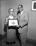 Dorothy Hoadley, left, receiving award for 25 years service at Harris Hosp. from W.P Earngey Jr.