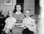Mrs. W. Gordon Sharratt, who was installed Friday as president of Cecilian Club of the Junior Woman's Club, is shown with her two sons, Michael and Pat