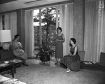 In the lounge, where the girls spend their "dress up" leisure time, are, Misses Jo Ann Peters, Hope Patterson and Judy Weir