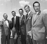 Maury Huffman points out the sights at Carter Field to four French airport experts