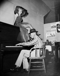 Spec Ryan tickles the ivories for the benefit of Miss Betty Ann Barton by Tony Record